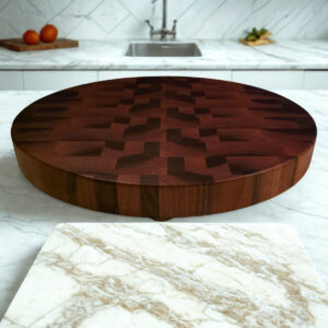 Thick round walnut butcher block, Compass Series on marble kitchen counter