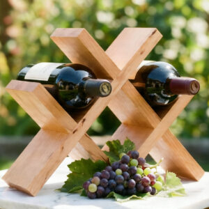 Handcrafted cherry wine rack with red wine bottles and grapes, X-frame joinery