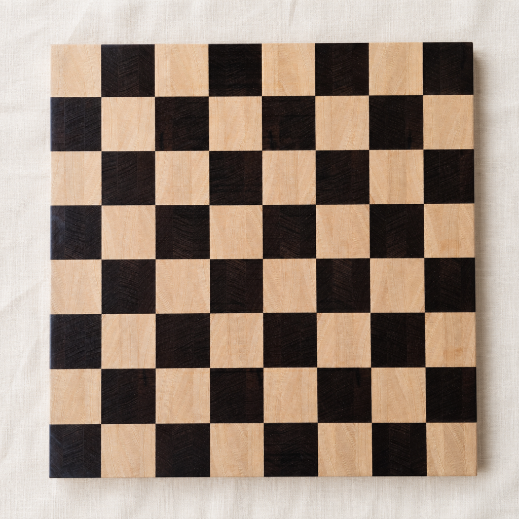 End-grain wenge and Lati chess board, top-down on off-white linen